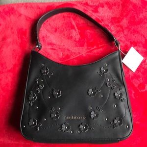 Liz Claiborne hobo with flower details. Magnetic closure, zipper pockets.